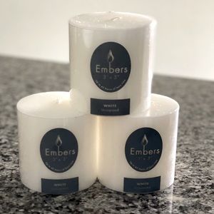 3 white cylinder wax candles